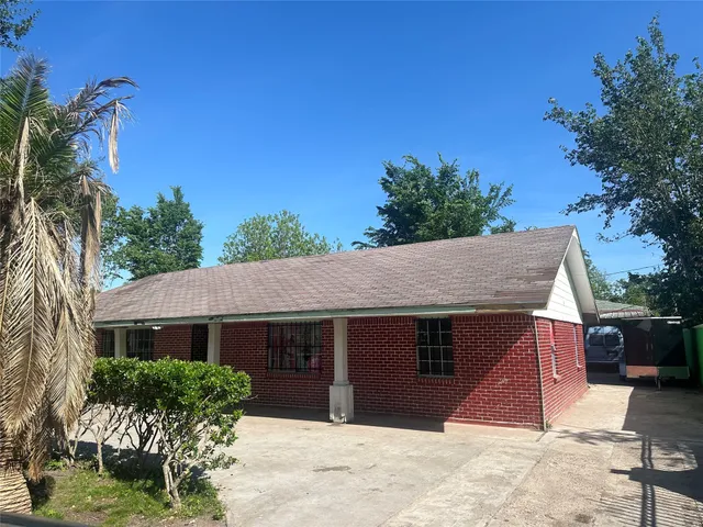 a view of green field with sitting area