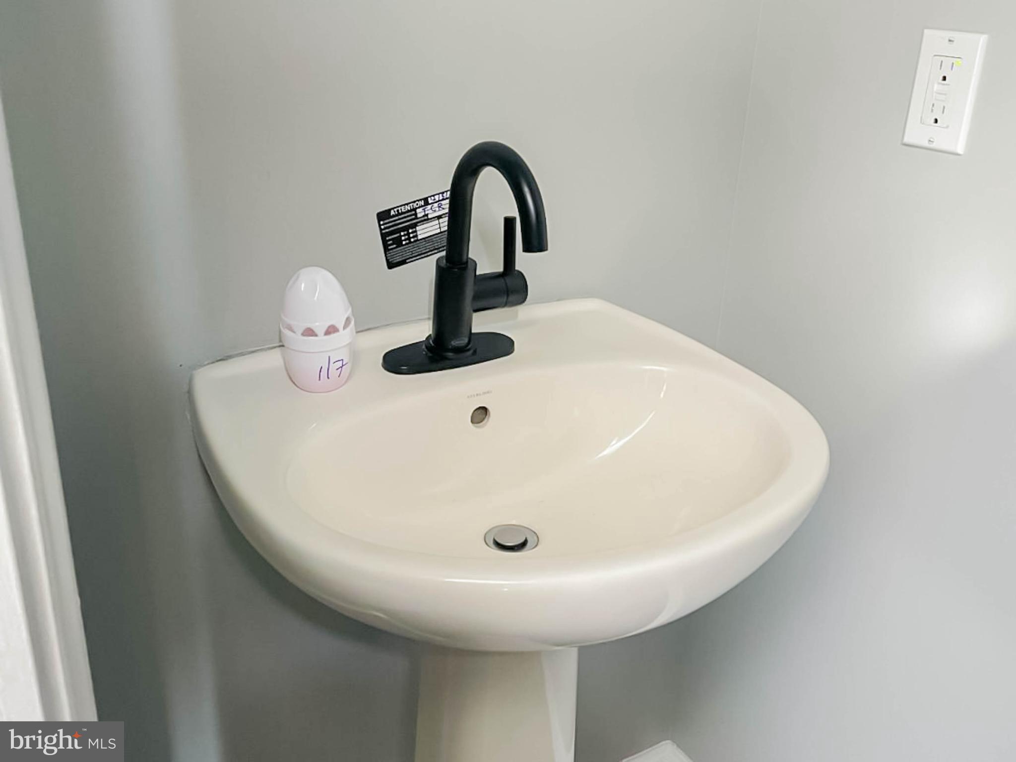 7 Tailor Lane Sicklerville, NJ 08081 - Photo 12 of 28 a close view of a sink and a mirror