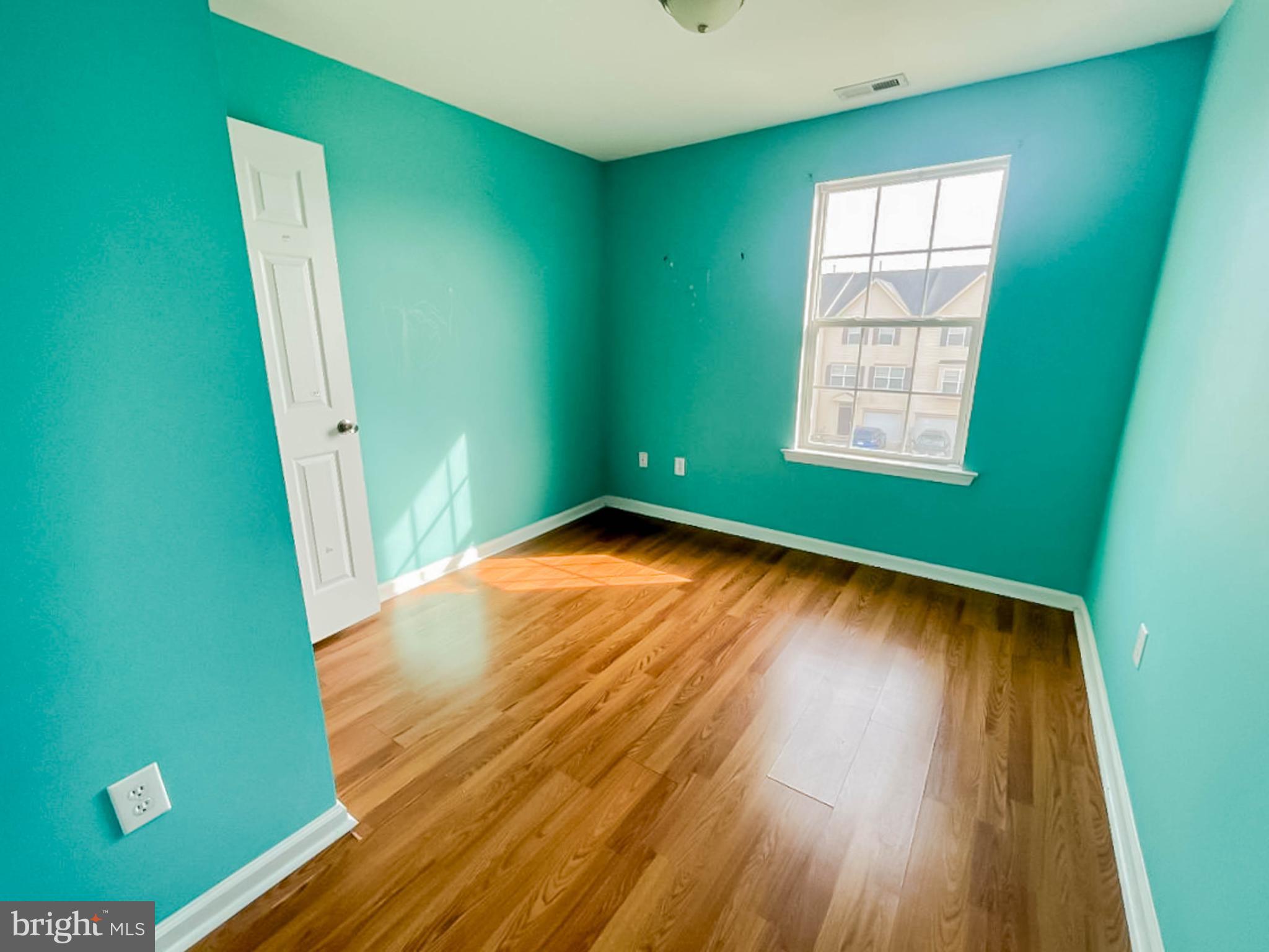 7 Tailor Lane Sicklerville, NJ 08081 - Photo 23 of 28 an empty room with wooden floor and windows