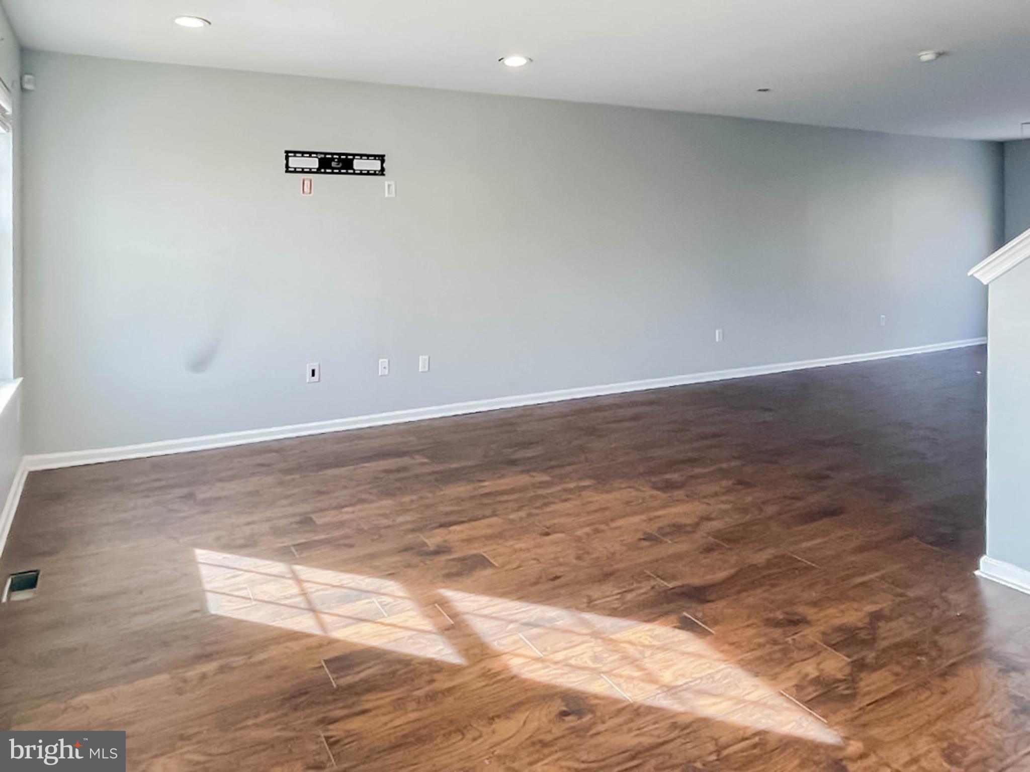 7 Tailor Lane Sicklerville, NJ 08081 - Photo 7 of 28 a view of a room with wooden floor and white walls