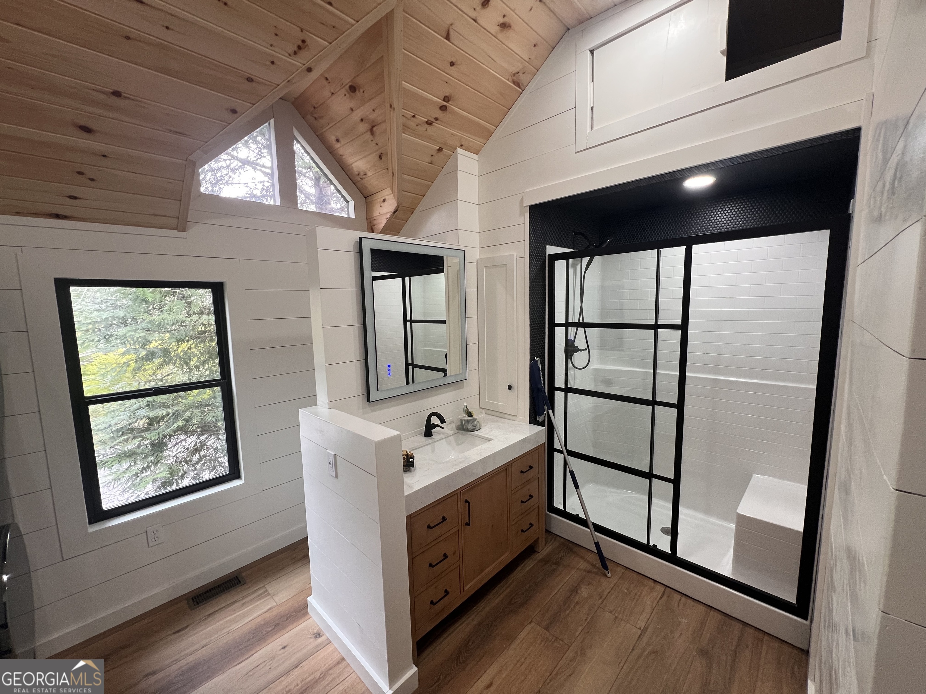 162 Dryman Ridge Road Scaly Mountain, NC 28775 - Photo 23 of 32 a utility room with stainless steel appliances wooden floors and view living room