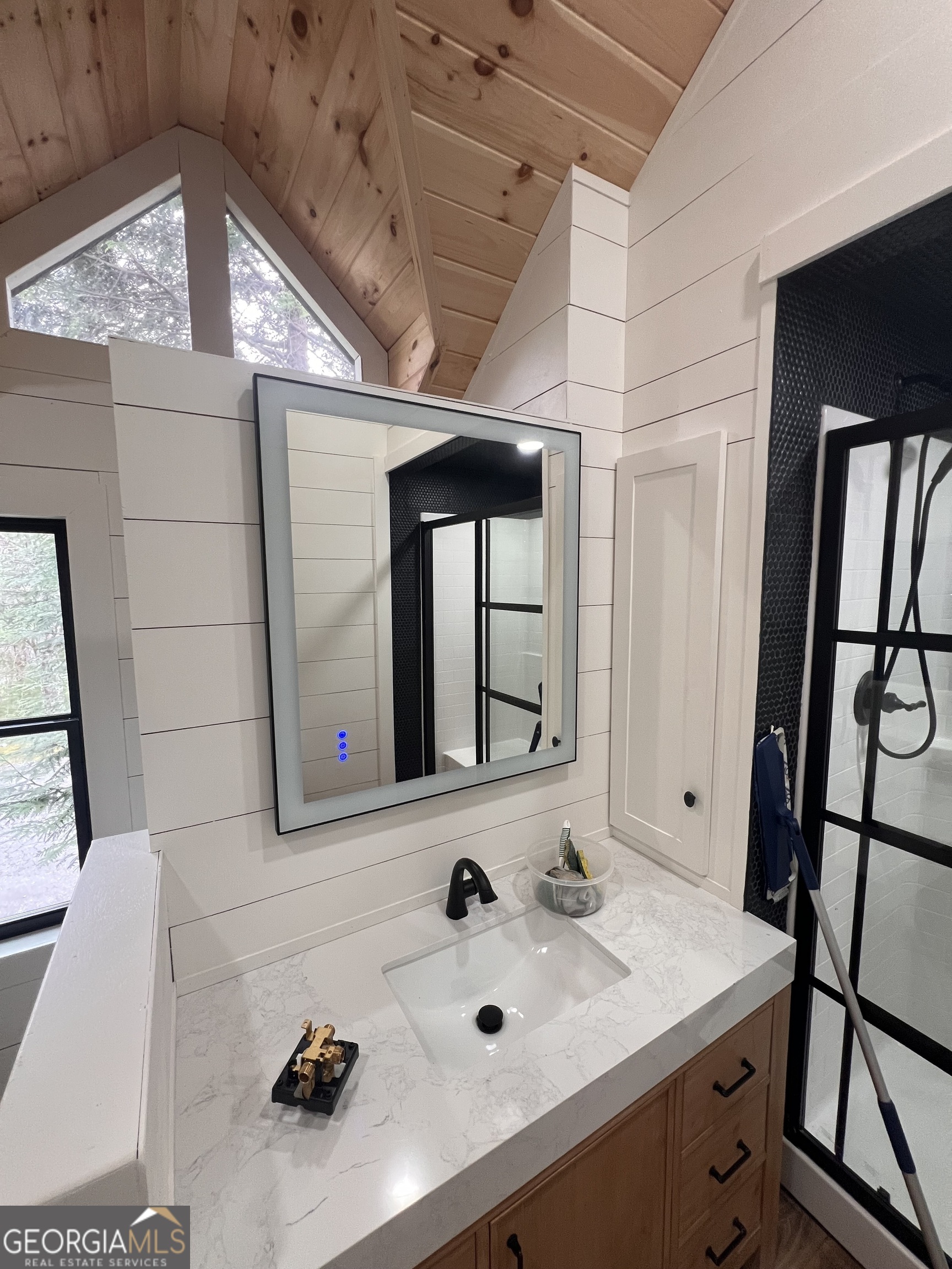 162 Dryman Ridge Road Scaly Mountain, NC 28775 - Photo 24 of 32 a bathroom with a sink and a mirror