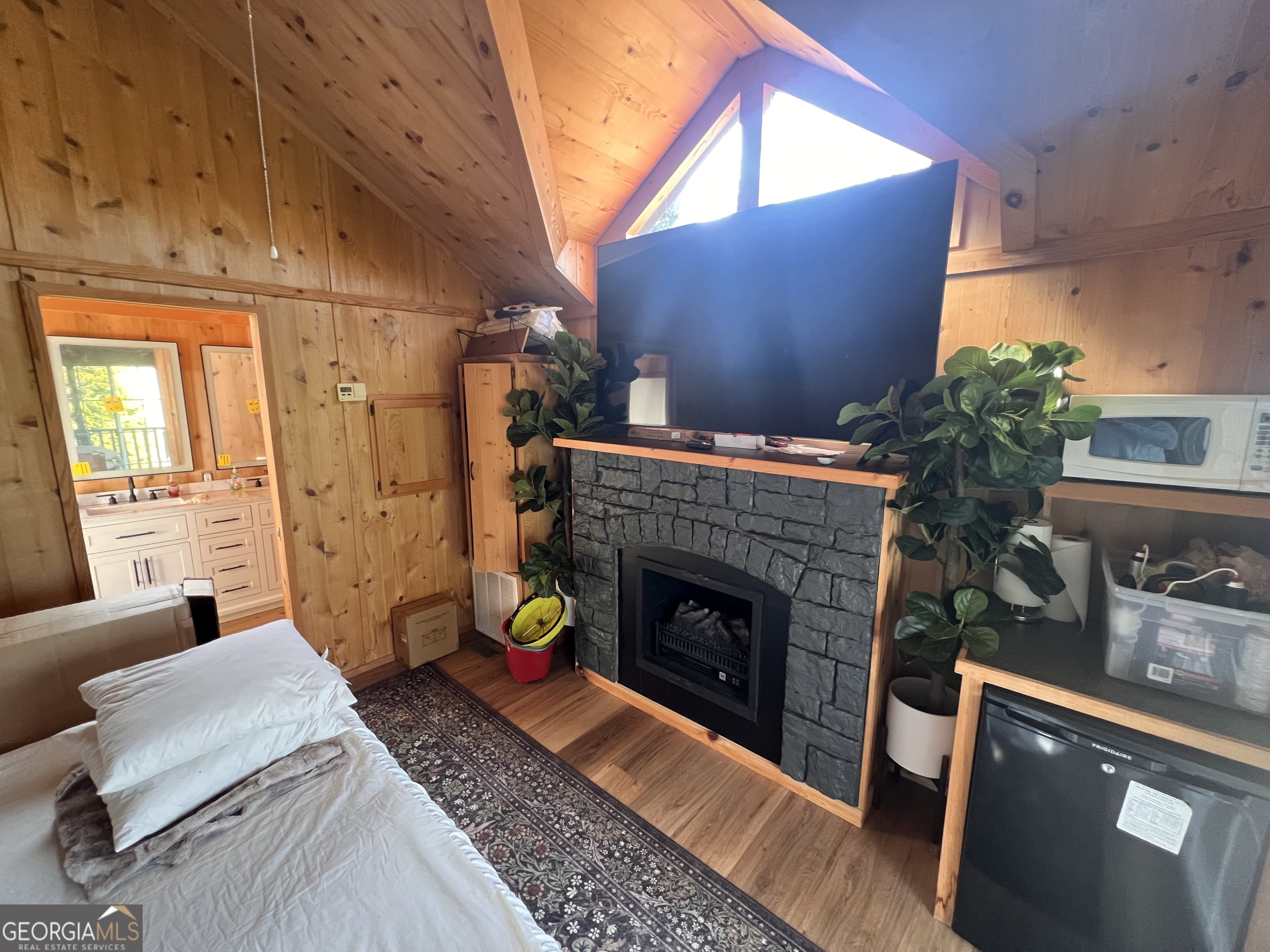 162 Dryman Ridge Road Scaly Mountain, NC 28775 - Photo 25 of 32 a living room with furniture and a fireplace
