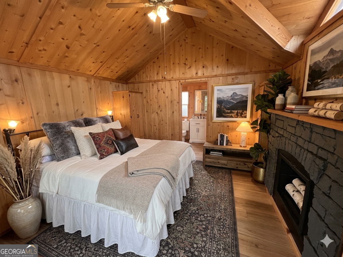 162 Dryman Ridge Road Scaly Mountain, NC 28775 - Photo 26 of 32 a bed room with a bed and a couch