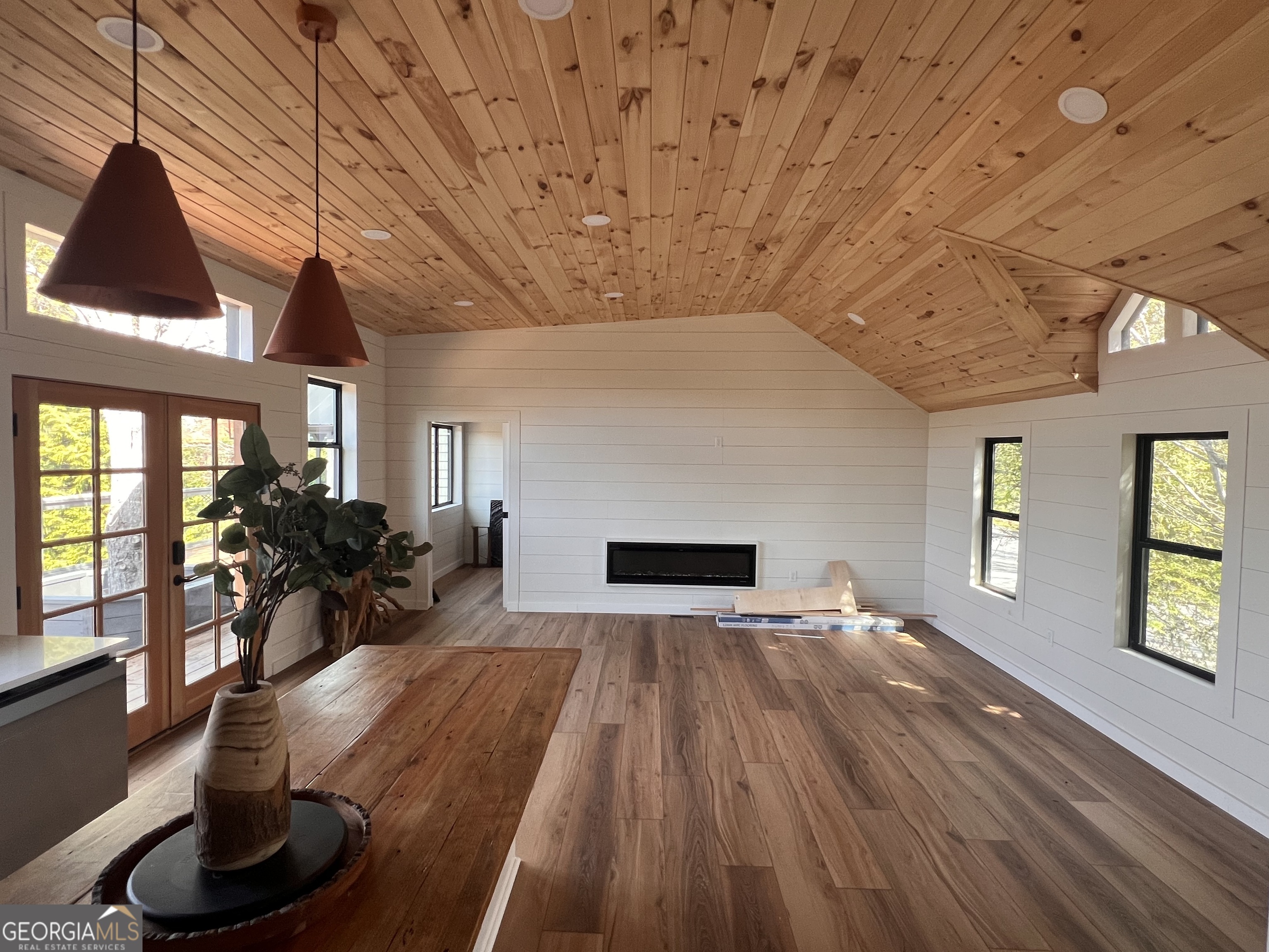 162 Dryman Ridge Road Scaly Mountain, NC 28775 - Photo 28 of 32 a view of a livingroom with furniture hardwood floor and a ceiling fan