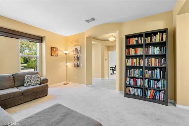 a dining room with furniture window and wooden floor