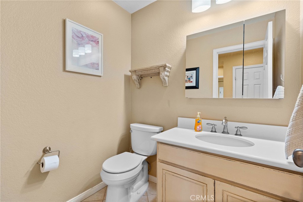 1137 Pamplona Drive Riverside, CA 92508 - Photo 14 of 50 a bathroom with a sink toilet and a mirror