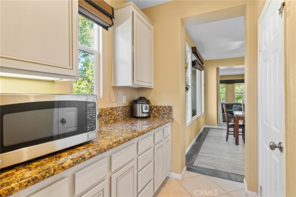 1137 Pamplona Drive Riverside, CA 92508 - Photo 20 of 50 a kitchen with granite countertop a window and a sink