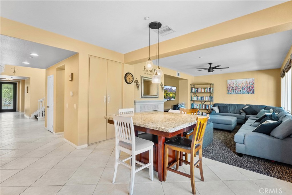 1137 Pamplona Drive Riverside, CA 92508 - Photo 21 of 50 a living room with furniture a dining table and chairs
