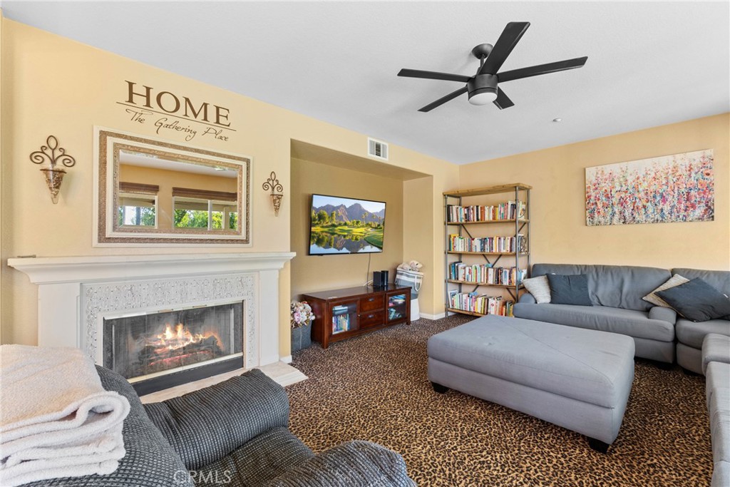 1137 Pamplona Drive Riverside, CA 92508 - Photo 24 of 50 a living room with furniture and a fireplace