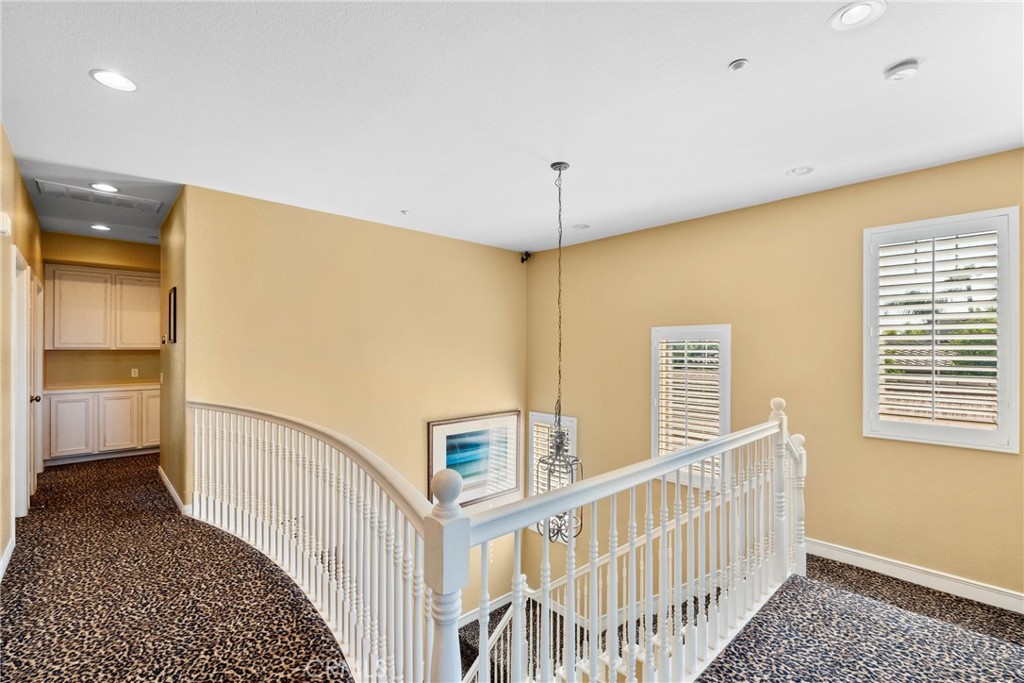 1137 Pamplona Drive Riverside, CA 92508 - Photo 26 of 50 a view of a hallway with a bedroom