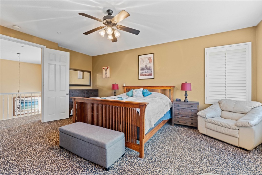 1137 Pamplona Drive Riverside, CA 92508 - Photo 28 of 50 a bedroom with a bed couches and window