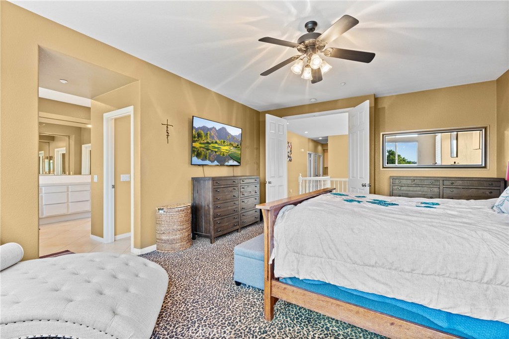 1137 Pamplona Drive Riverside, CA 92508 - Photo 29 of 50 a bedroom with a bed and a chandelier