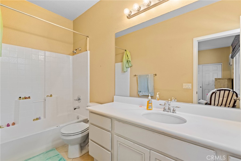 1137 Pamplona Drive Riverside, CA 92508 - Photo 34 of 50 a bathroom with a double vanity sink toilet and shower