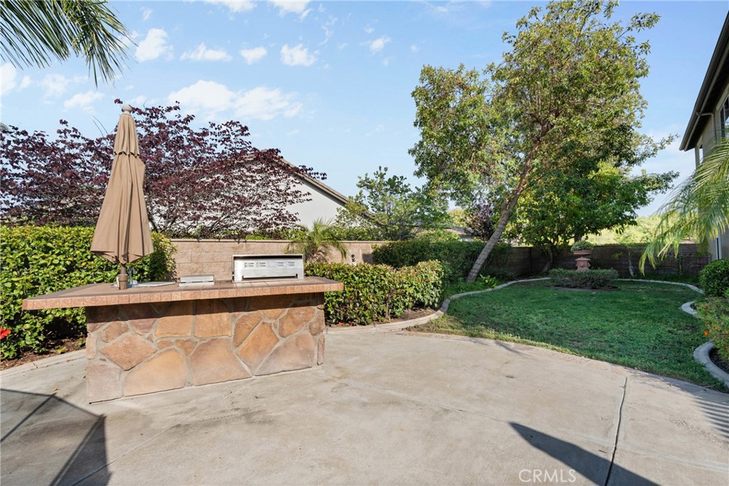 1137 Pamplona Drive Riverside, CA 92508 - Photo 39 of 50 a view of a yard with a fountain and a bench
