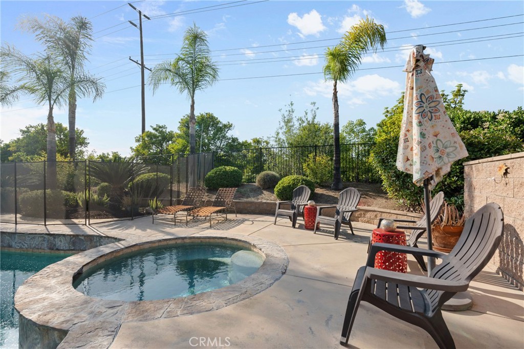 1137 Pamplona Drive Riverside, CA 92508 - Photo 41 of 50 a view of backyard with swimming pool and outdoor seating