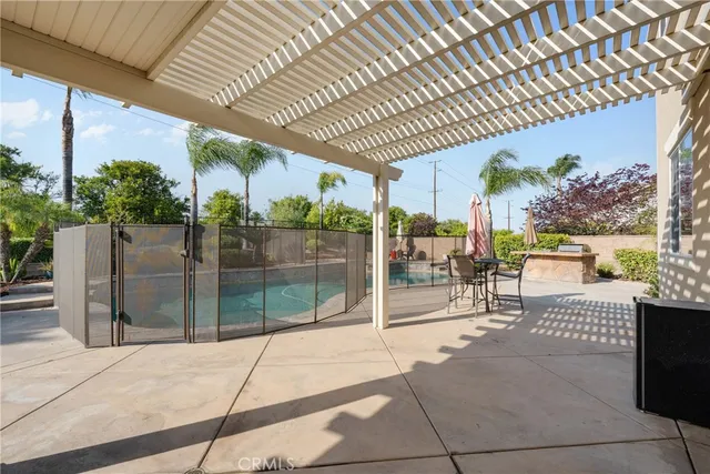 a view of a house with a yard and sitting area