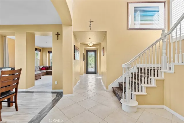 a view of entryway and hall with dining room