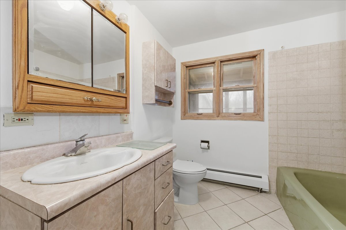 6N879 Dunham Road Wayne, IL 60184 - Photo 15 of 27 a bathroom with a sink and a mirror