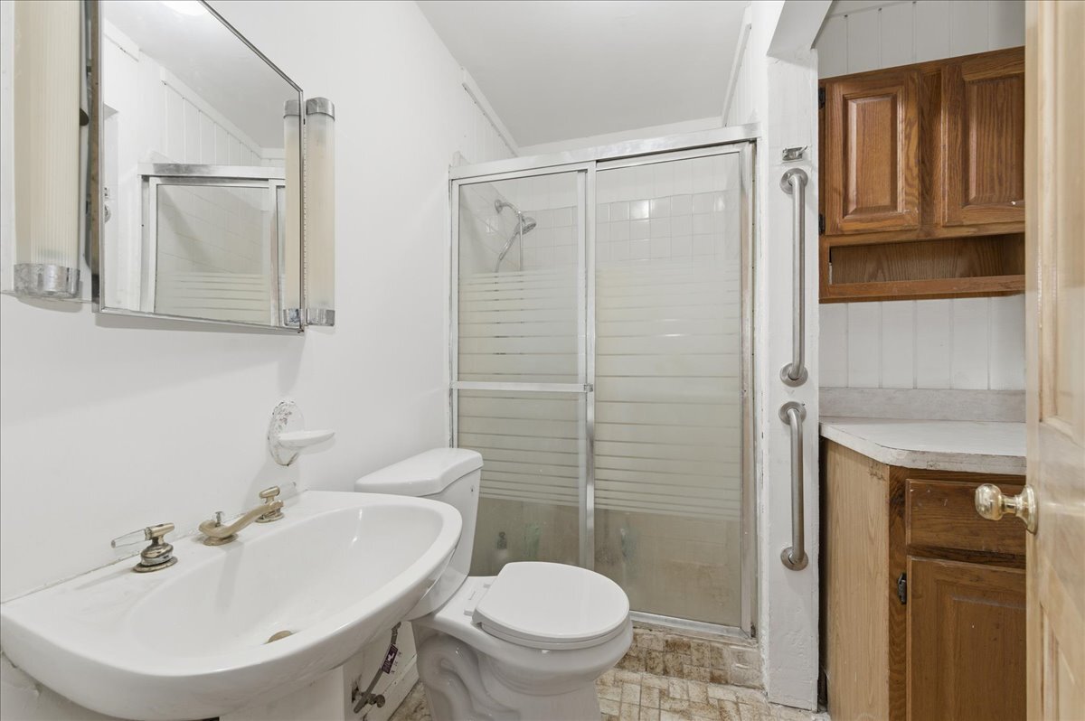 6N879 Dunham Road Wayne, IL 60184 - Photo 20 of 27 a bathroom with a sink a toilet and shower
