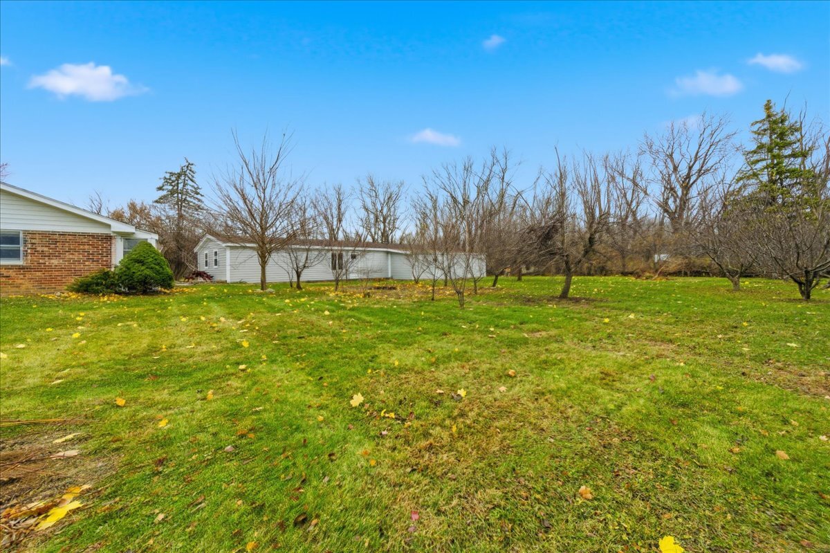 6N879 Dunham Road Wayne, IL 60184 - Photo 27 of 27 a view of a field with trees in the background