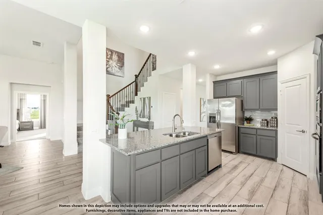 a view of kitchen with cabinets and wooden floor