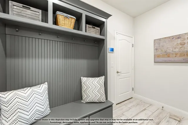 a kitchen with stainless steel appliances granite countertop a stove top oven a sink dishwasher a dining table and chairs with wooden cabinets