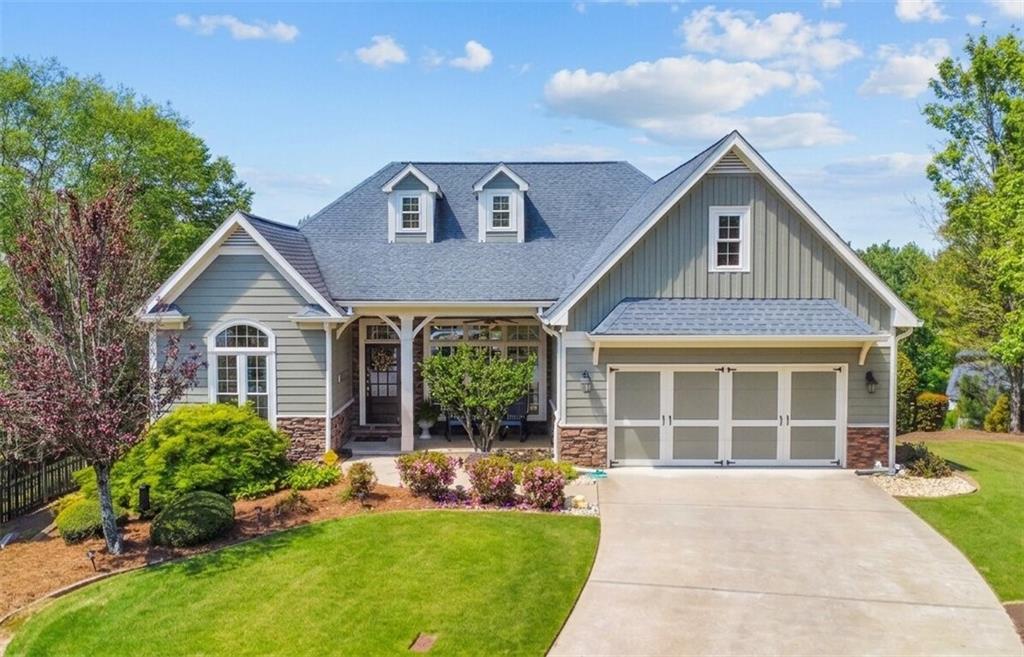 304 Turning Leaf Court Canton, GA 30115 - Photo 1 of 73 a front view of a house with a yard and garage