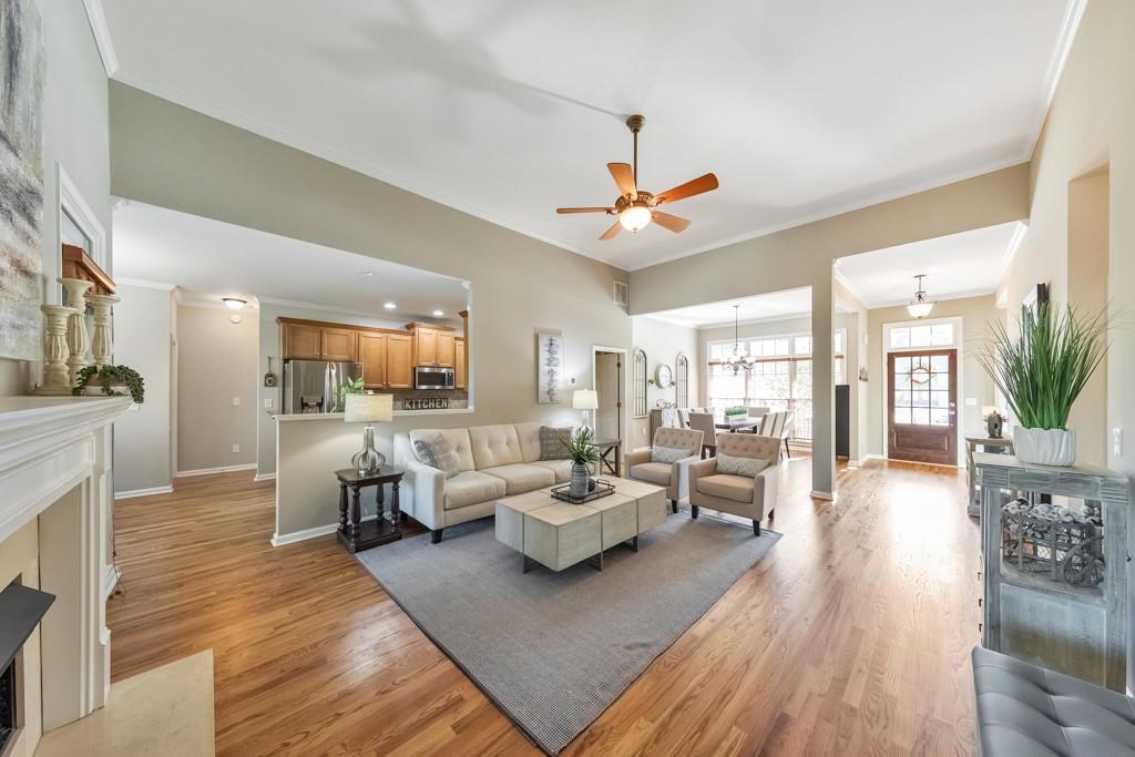 304 Turning Leaf Court Canton, GA 30115 - Photo 12 of 73 a living room with furniture or kitchen view and a wooden floor