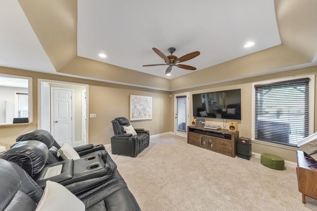 304 Turning Leaf Court Canton, GA 30115 - Photo 36 of 73 a living room with furniture and a flat screen tv