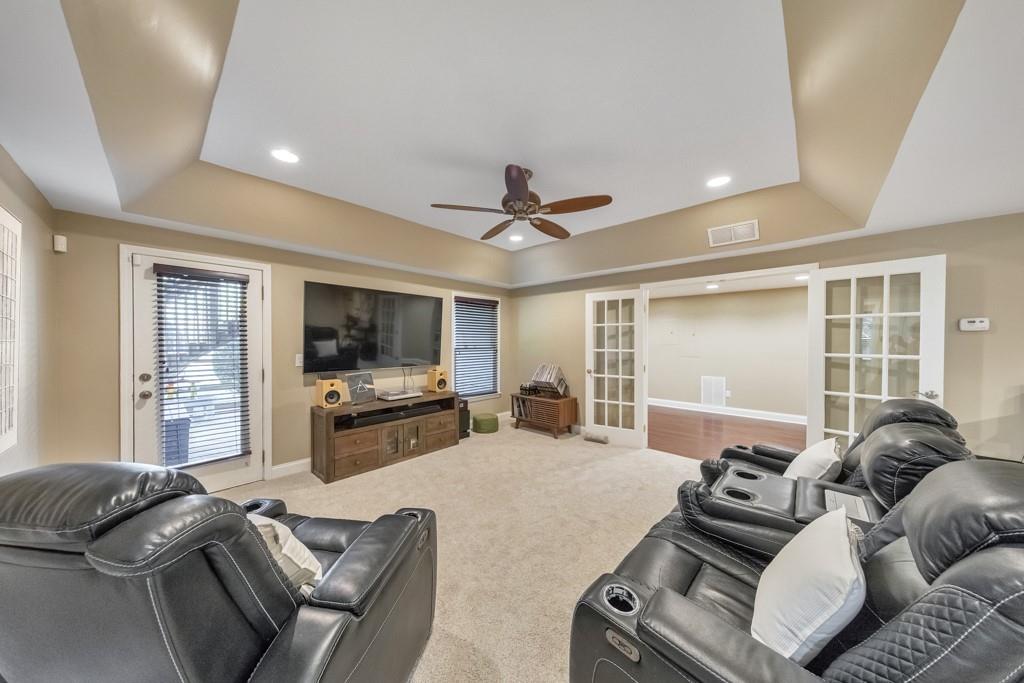 304 Turning Leaf Court Canton, GA 30115 - Photo 37 of 73 a living room with furniture and a flat screen tv