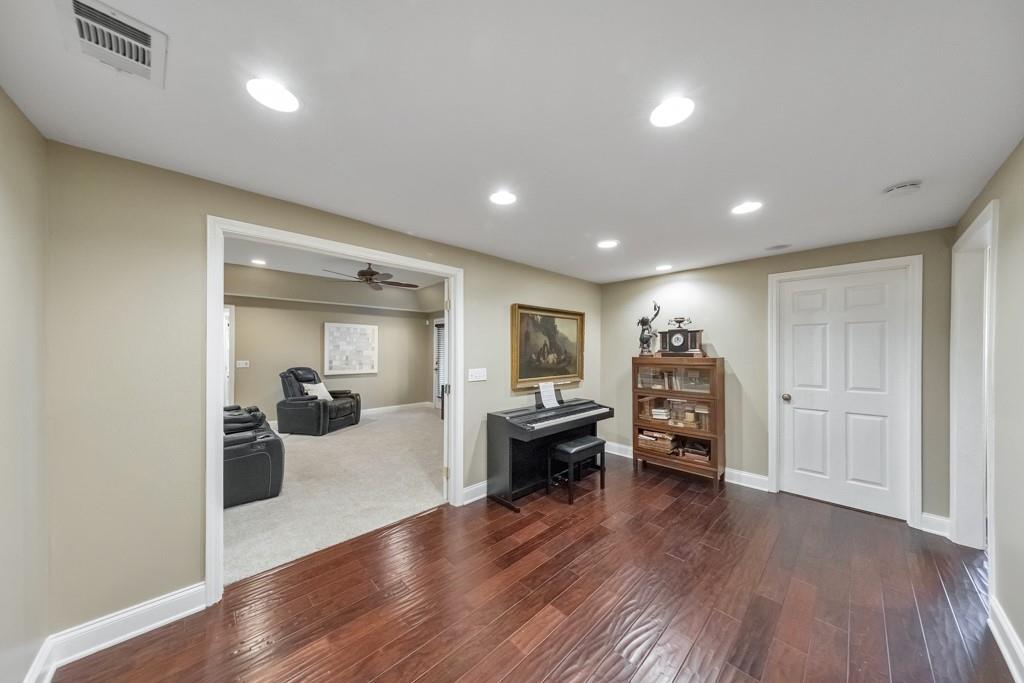 304 Turning Leaf Court Canton, GA 30115 - Photo 38 of 73 a view of a livingroom with furniture and wooden floor