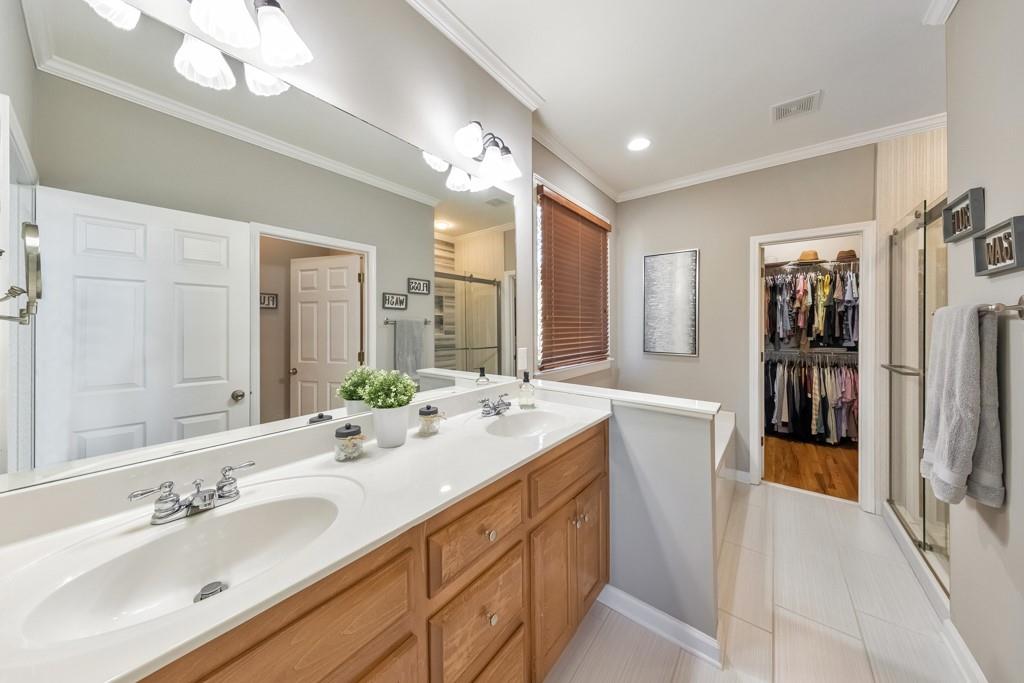 304 Turning Leaf Court Canton, GA 30115 - Photo 4 of 73 a spacious bathroom with a double vanity sink mirror and double