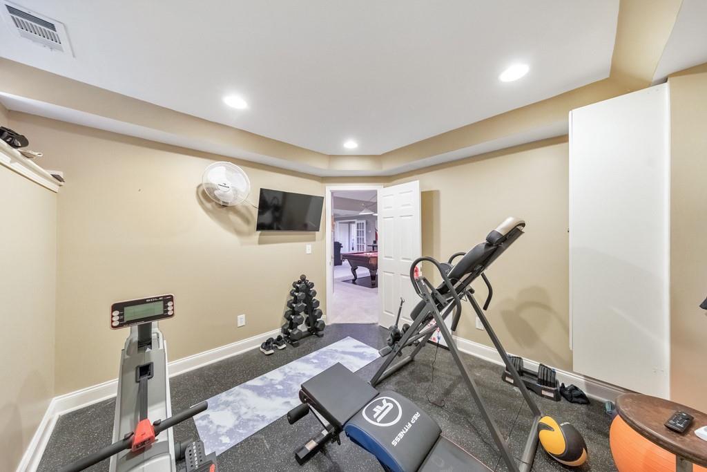 304 Turning Leaf Court Canton, GA 30115 - Photo 43 of 73 a view of a room with gym equipment
