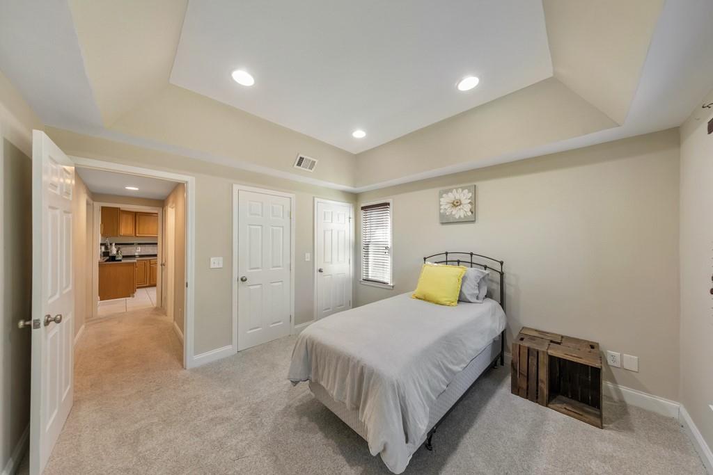 304 Turning Leaf Court Canton, GA 30115 - Photo 50 of 73 a bedroom with a bed and painted walls