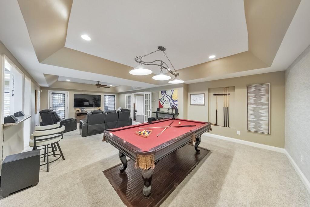 304 Turning Leaf Court Canton, GA 30115 - Photo 5 of 73 a living room with furniture a table tennis and flat screen tv