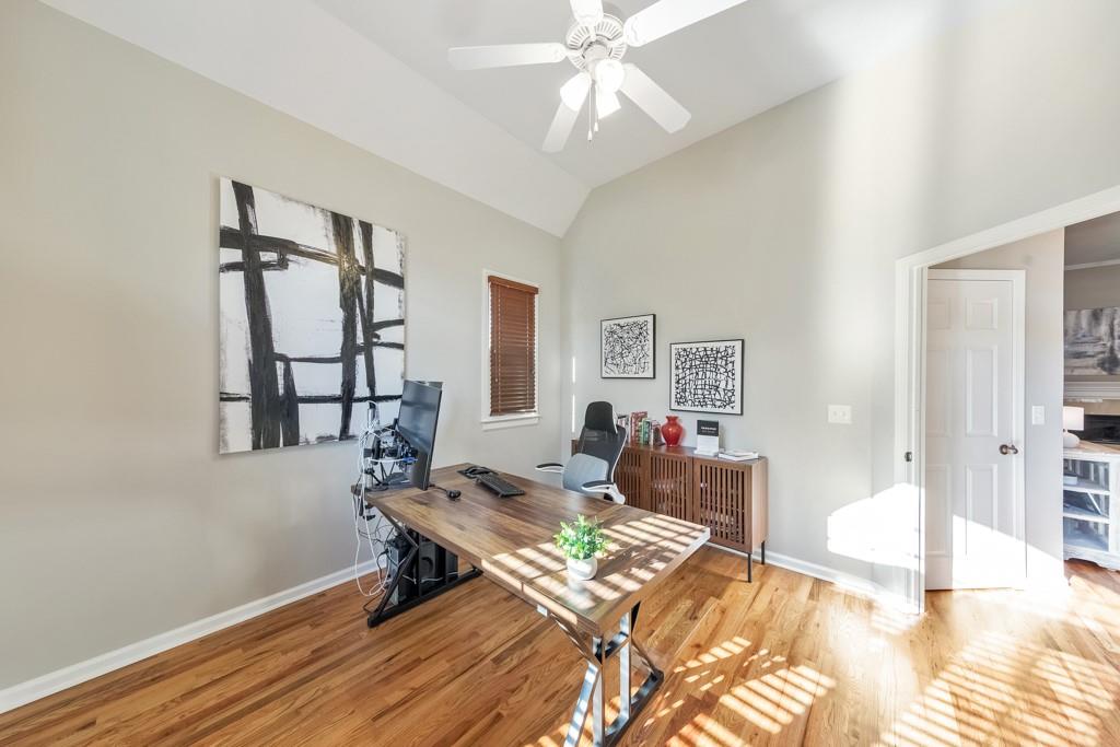 304 Turning Leaf Court Canton, GA 30115 - Photo 52 of 73 a bedroom with a bed and wooden floor