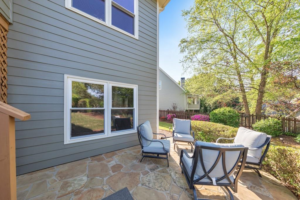 304 Turning Leaf Court Canton, GA 30115 - Photo 59 of 73 a view of a patio with a table and chairs and couches