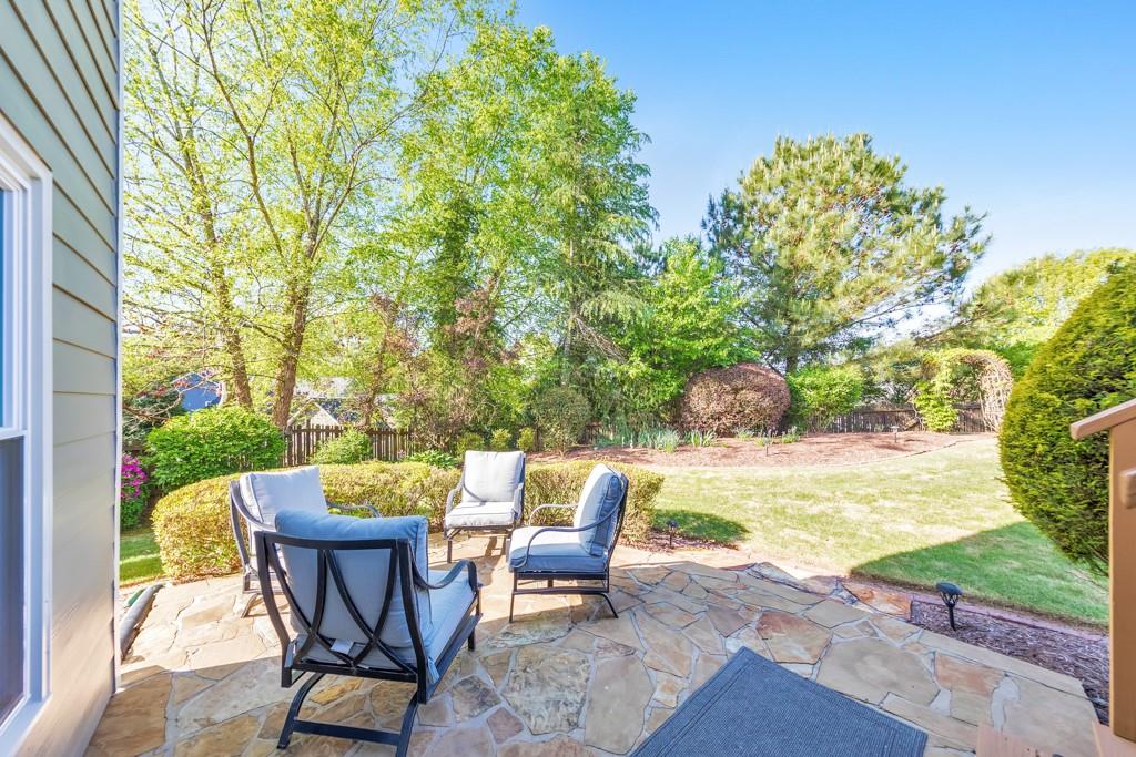 304 Turning Leaf Court Canton, GA 30115 - Photo 61 of 73 a view of a patio with table and chairs and potted plants