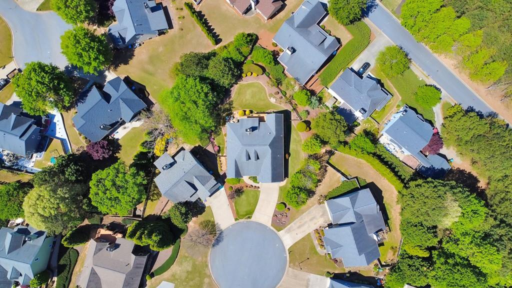 304 Turning Leaf Court Canton, GA 30115 - Photo 68 of 73 an aerial view of a house with a swimming pool and lawn chairs