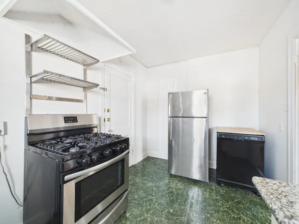 a view of room with empty cabinets