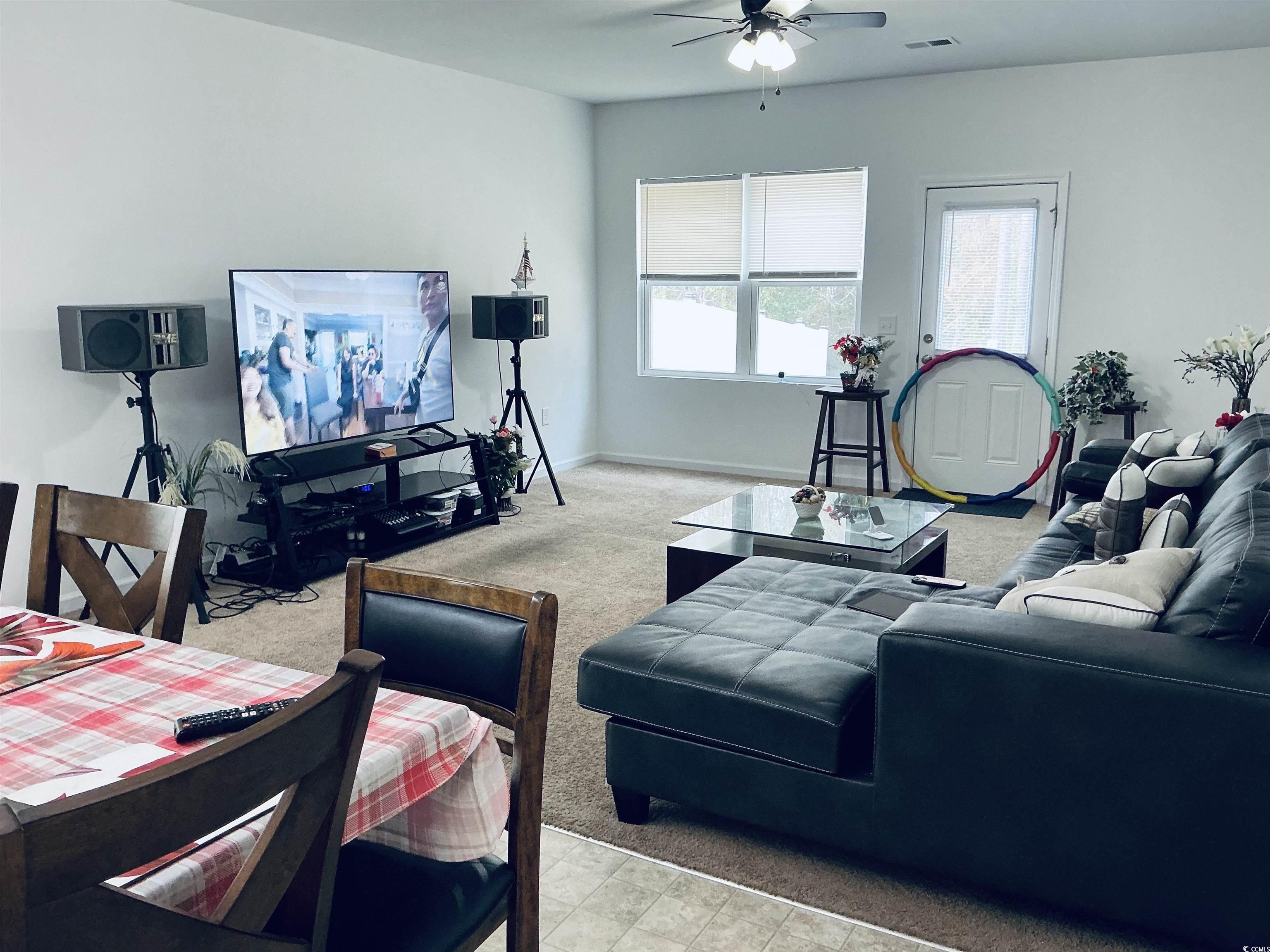 5260 Walnutwood Trail Myrtle Beach, SC 29579 - Photo 10 of 30 Living room with light colored carpet and ceiling fan