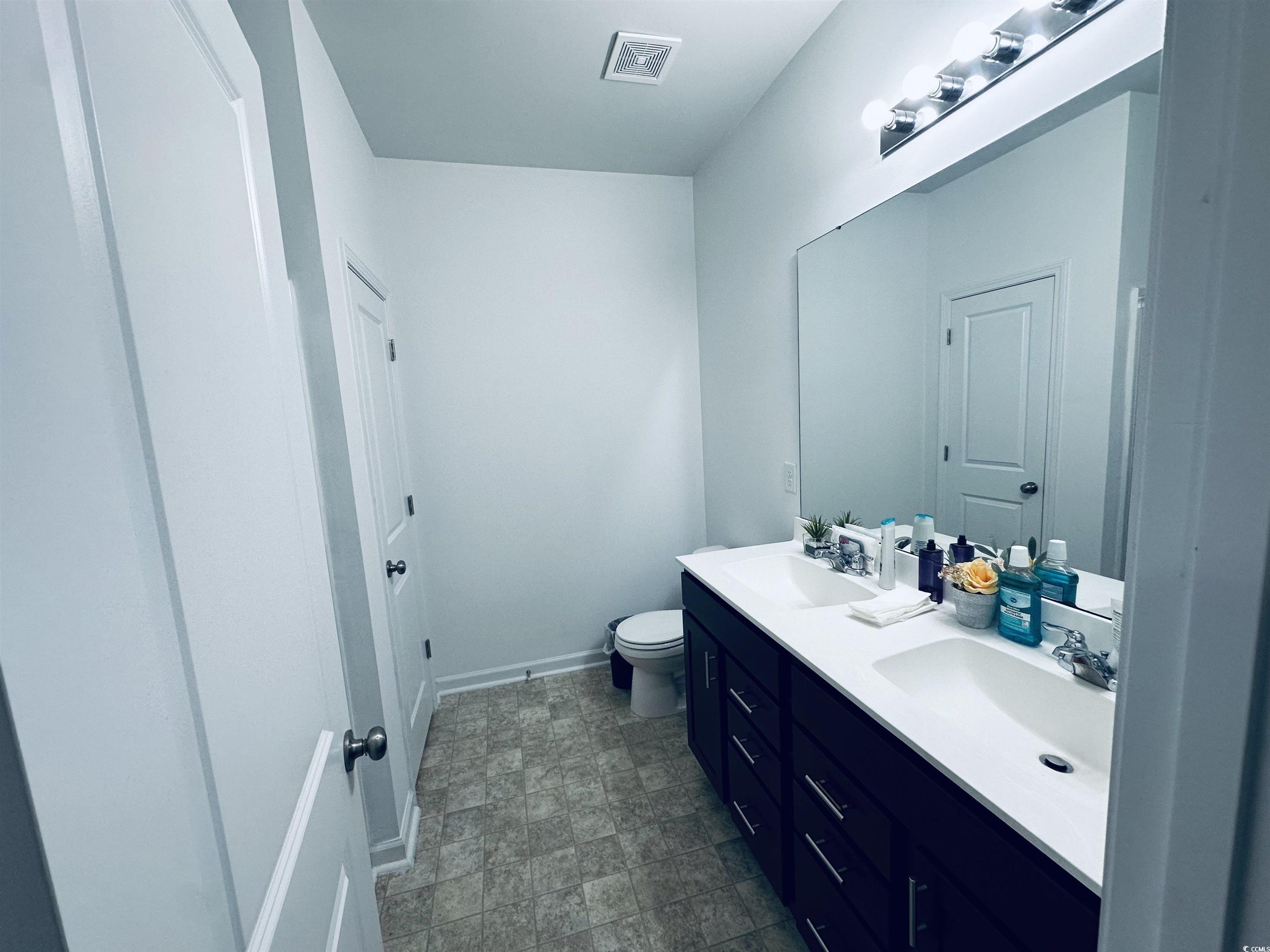 5260 Walnutwood Trail Myrtle Beach, SC 29579 - Photo 14 of 30 Full bathroom featuring double vanity and toilet