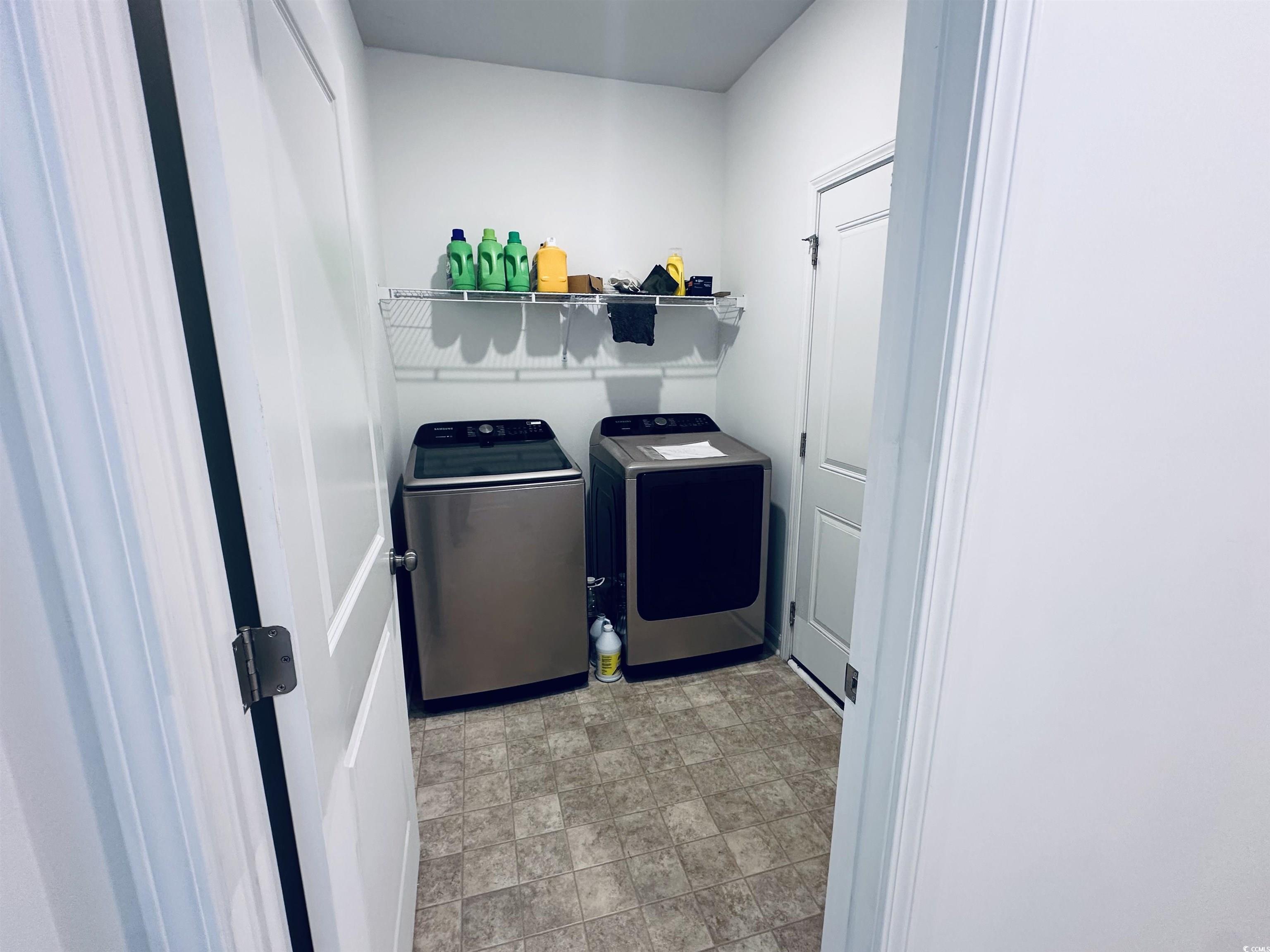 5260 Walnutwood Trail Myrtle Beach, SC 29579 - Photo 5 of 30 Laundry area with washing machine and dryer and stone finish flooring