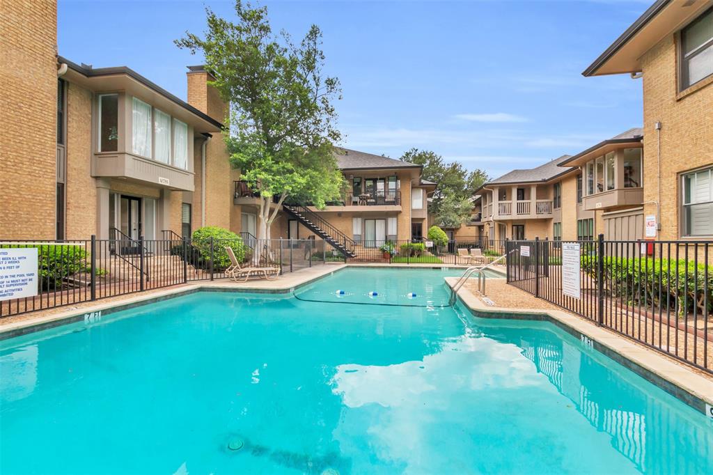 10763 Villager Road, Unit A Dallas, TX 75230 - Photo 21 of 21 a view of a house with a yard patio and swimming pool