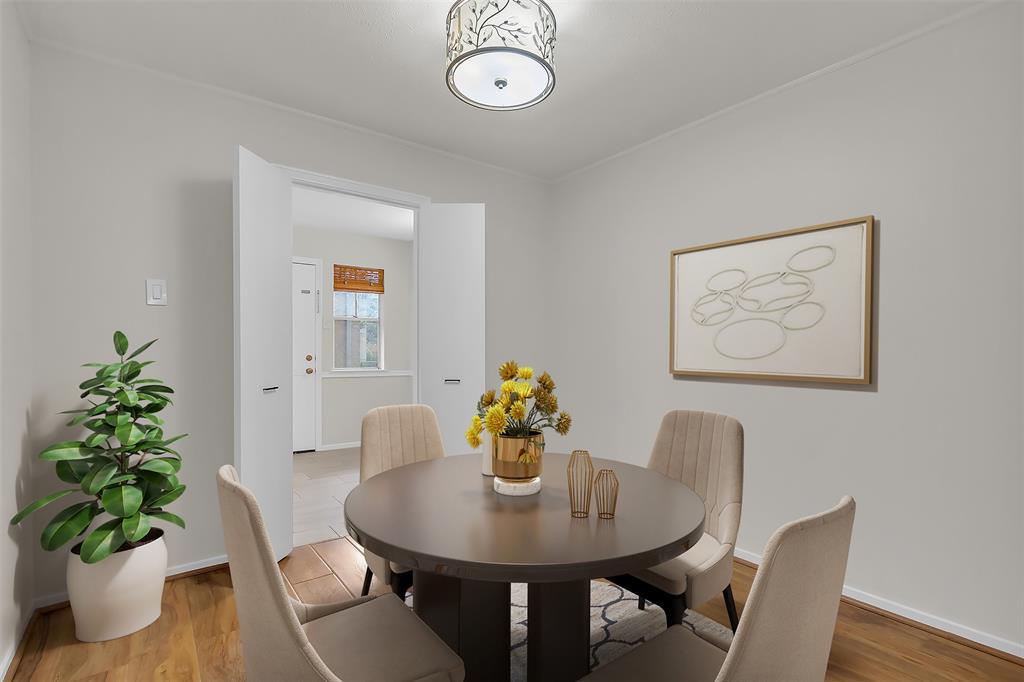 10763 Villager Road, Unit A Dallas, TX 75230 - Photo 5 of 21 a view of a dining room with furniture and wooden floor
