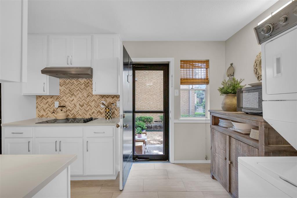 10763 Villager Road, Unit A Dallas, TX 75230 - Photo 8 of 21 a kitchen with stainless steel appliances granite countertop a stove and a refrigerator