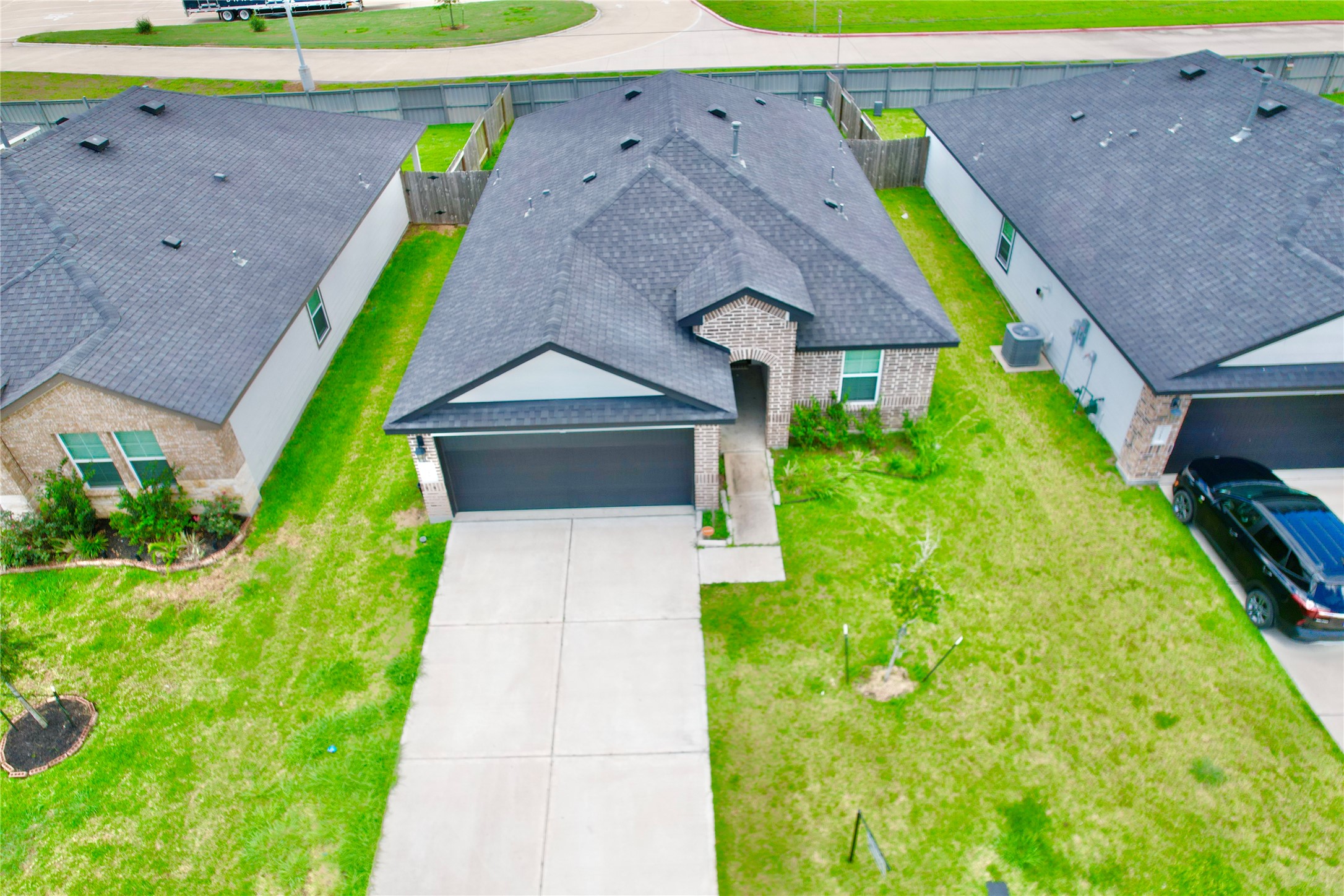 7518 Cynomys Court Rosharon, TX 77583 - Photo 2 of 21 a aerial view of a house with a yard and a large parking space