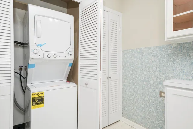 a close up view of a storage & utility room with a washer dryer