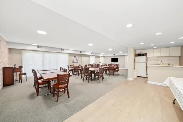 a view of a dining area with furniture and chandelier